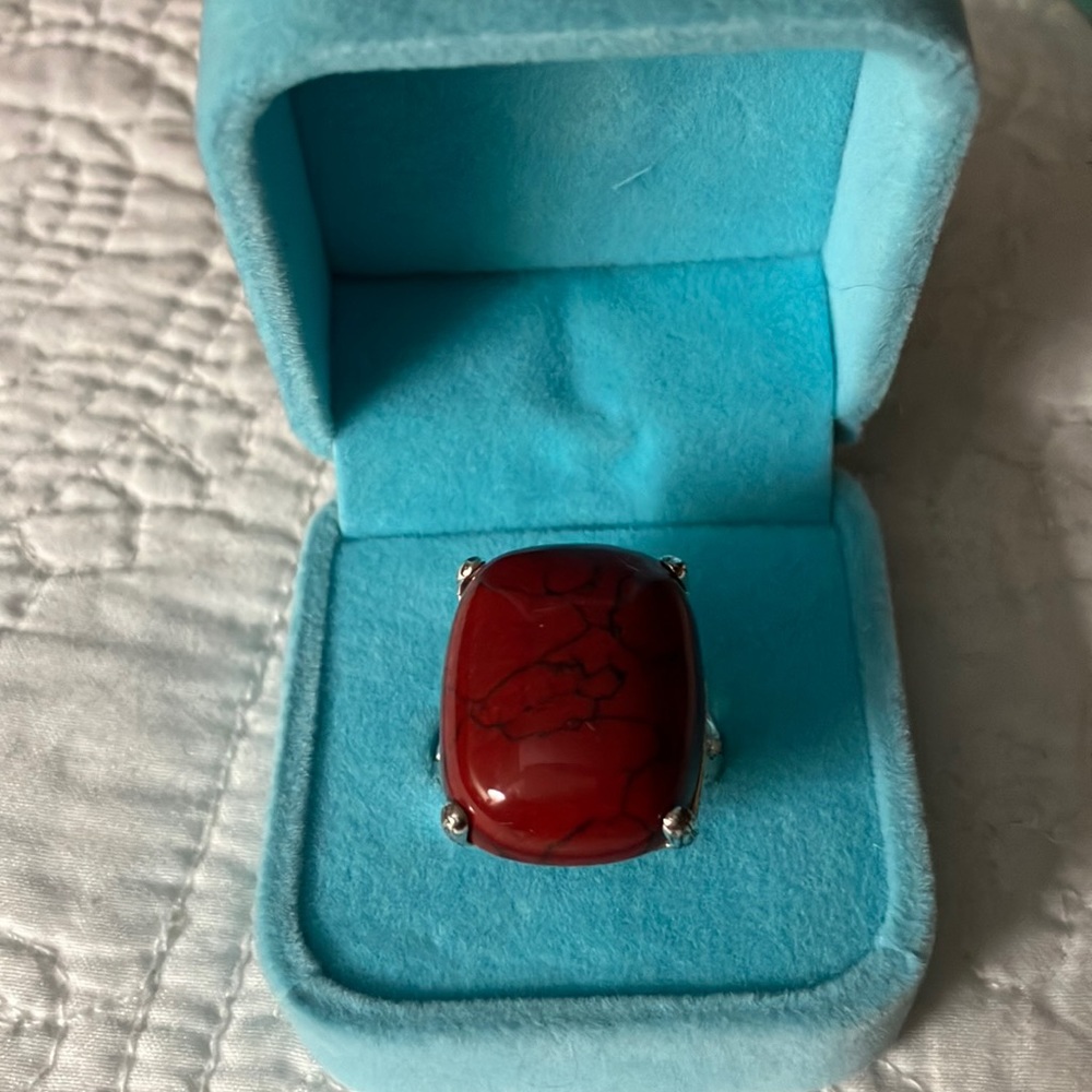 New red with lines of black go thru thru stone!